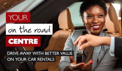 Your on the road centre - drive away with better value on your car rentals. Businesswoman being handed the keys to a car