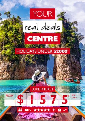 Your real deals centre - Holidays under $2,000* Luxe Phuket from $1,575* for two. Person in large pink dress on a boat, sailing through tall tree-topped rocks