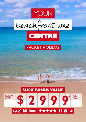 Your beachfront luxe centre - Phuket holiday. $1,300* bonus value return from $2,999* for two. Wide shot of a couple on a beach